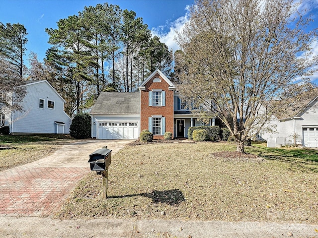 view of front of property with a front lawn and a garage