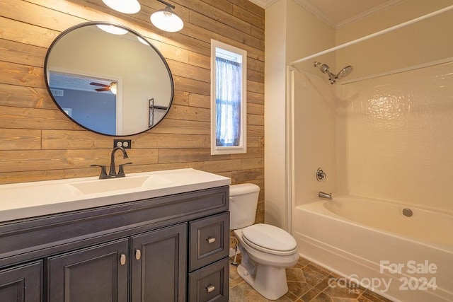 full bathroom featuring bathing tub / shower combination, wood walls, crown molding, toilet, and vanity