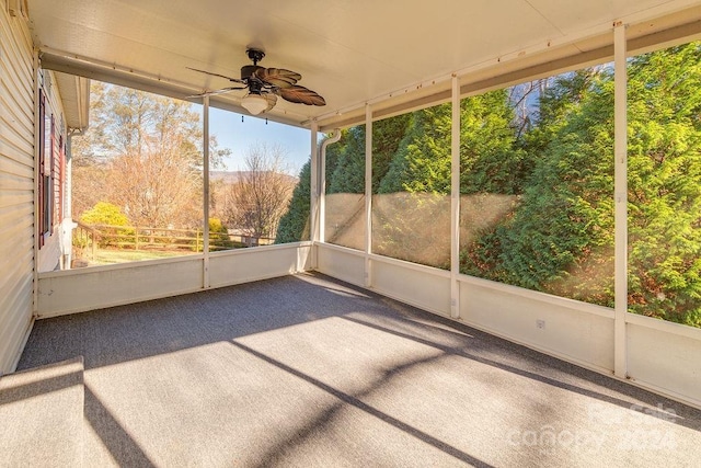 unfurnished sunroom featuring a wealth of natural light