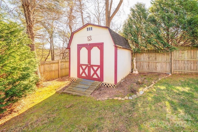 view of outdoor structure featuring a lawn