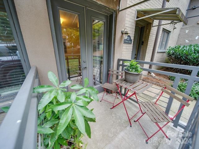 balcony featuring french doors