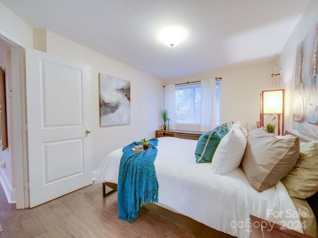 bedroom featuring wood-type flooring