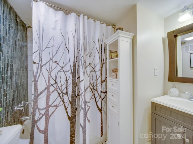 bathroom with vanity and shower / bath combo