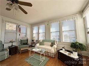 sunroom / solarium with plenty of natural light and ceiling fan