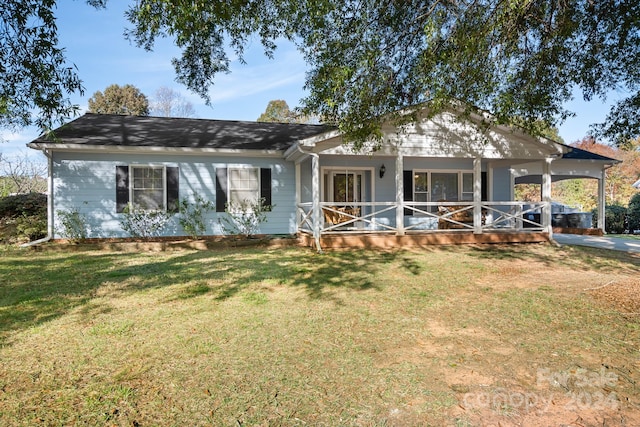 view of front of home featuring a front yard and a porch