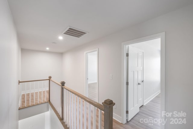 corridor featuring light hardwood / wood-style floors