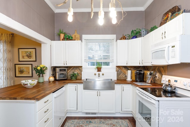 kitchen featuring white cabinetry, pendant lighting, white appliances, and wood counters