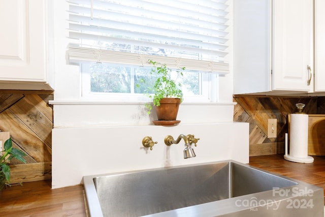 details featuring white cabinetry and sink