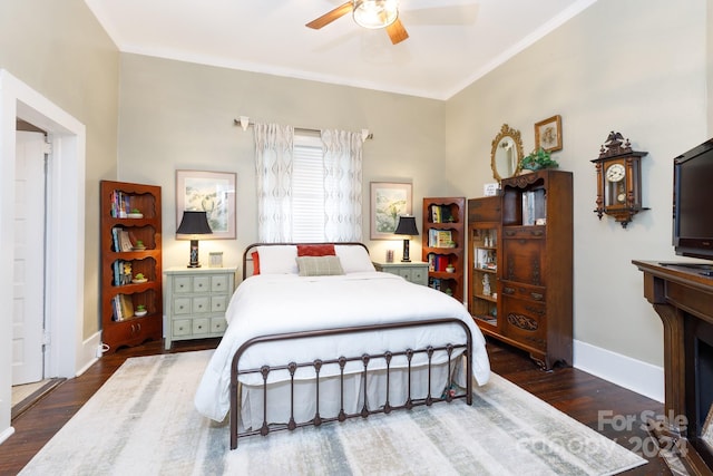 bedroom with dark hardwood / wood-style floors, ceiling fan, and ornamental molding