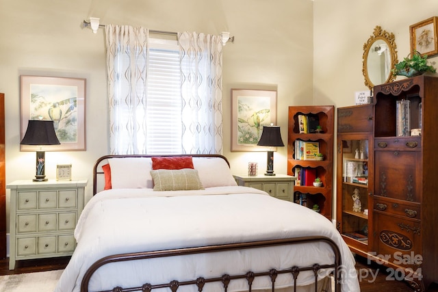 bedroom featuring dark wood-type flooring