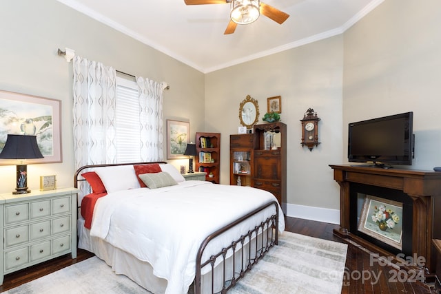 bedroom with hardwood / wood-style floors, ceiling fan, and crown molding