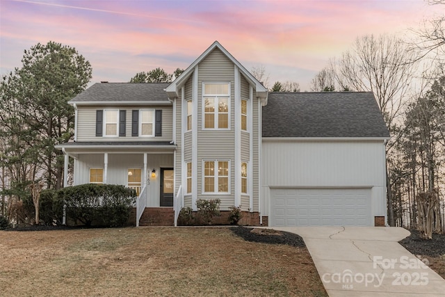 front of property featuring a lawn and covered porch