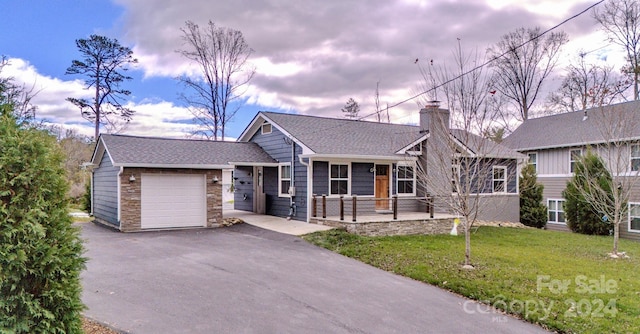 view of front facade with a lawn and a garage