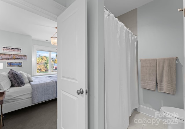 bathroom with a shower with curtain and toilet