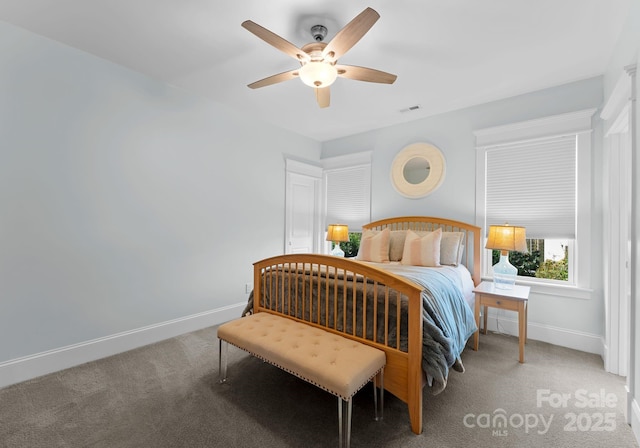 carpeted bedroom with ceiling fan