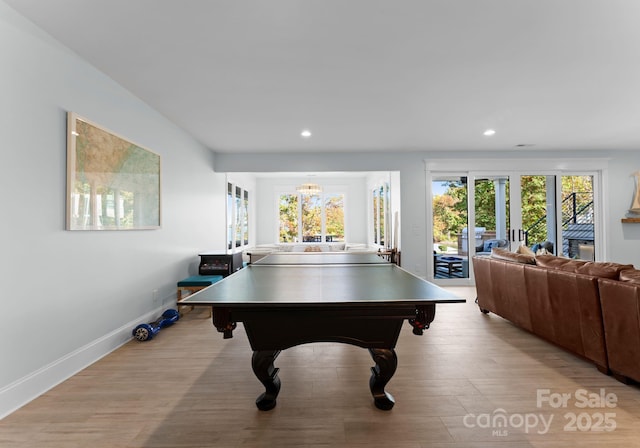 rec room featuring light hardwood / wood-style flooring and plenty of natural light