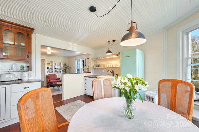 dining area featuring dark hardwood / wood-style flooring