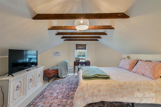 bedroom featuring a chandelier and vaulted ceiling with beams