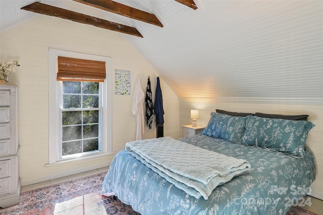 bedroom with tile patterned flooring, vaulted ceiling with beams, and ceiling fan