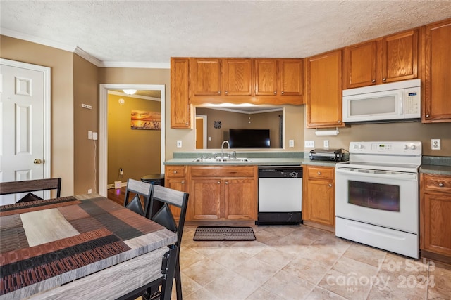 kitchen featuring a textured ceiling, white appliances, ornamental molding, and sink