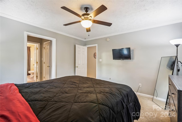 bedroom with a textured ceiling, ceiling fan, ornamental molding, and light carpet