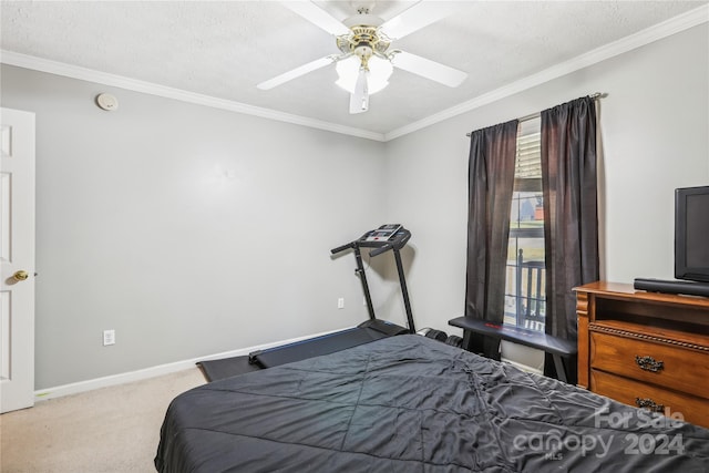 bedroom featuring ceiling fan, light colored carpet, a textured ceiling, and ornamental molding