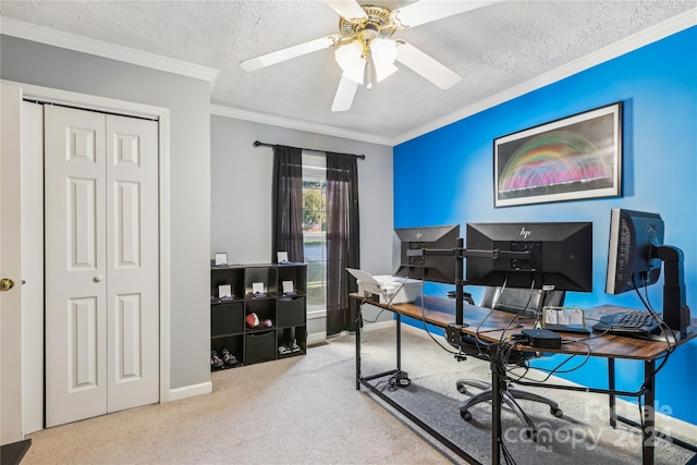 home office featuring ceiling fan, crown molding, carpet floors, and a textured ceiling