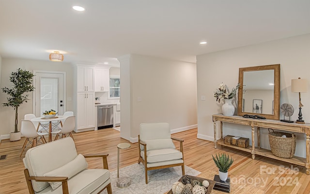 sitting room with light hardwood / wood-style floors