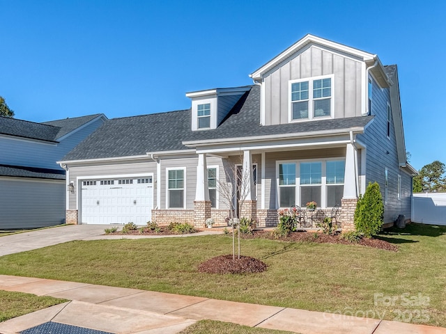 view of front of house featuring a front yard and a garage