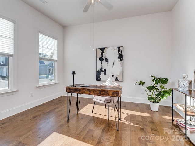 office space with ceiling fan and dark hardwood / wood-style floors