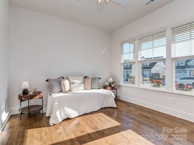 bedroom featuring ceiling fan and dark wood-type flooring