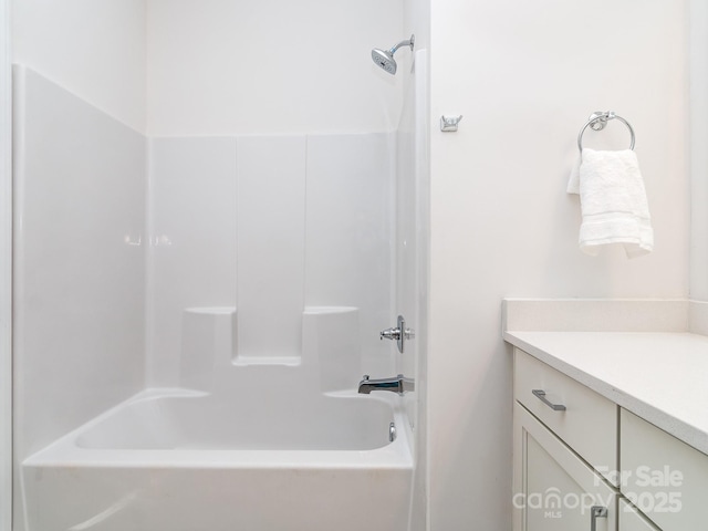 bathroom featuring vanity and tub / shower combination