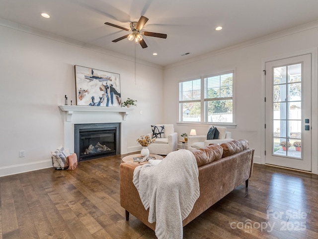 living room featuring ceiling fan, crown molding, and dark hardwood / wood-style floors