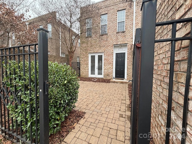 view of gate featuring french doors