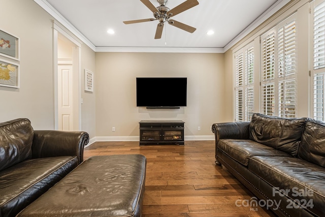 living room featuring crown molding, ceiling fan, and dark wood-type flooring