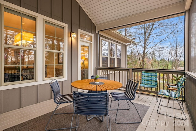 sunroom / solarium with vaulted ceiling and wood ceiling