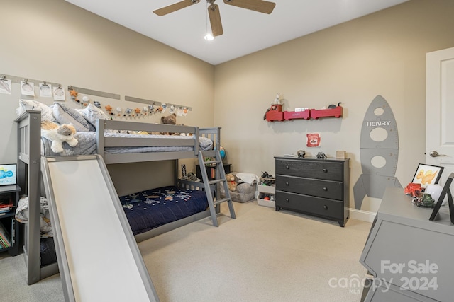 bedroom featuring light colored carpet and ceiling fan