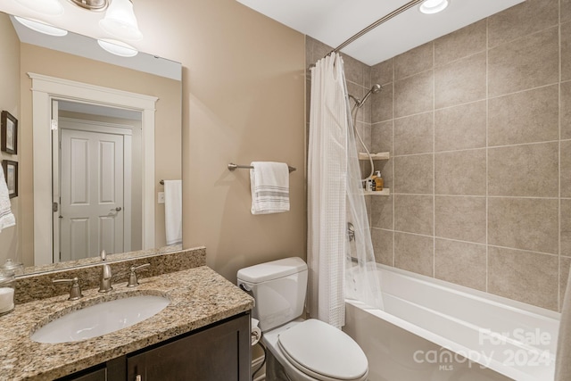 full bathroom featuring vanity, toilet, and shower / bathtub combination with curtain