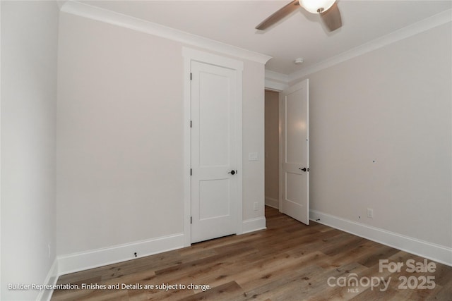 unfurnished bedroom with baseboards, a ceiling fan, wood finished floors, and ornamental molding