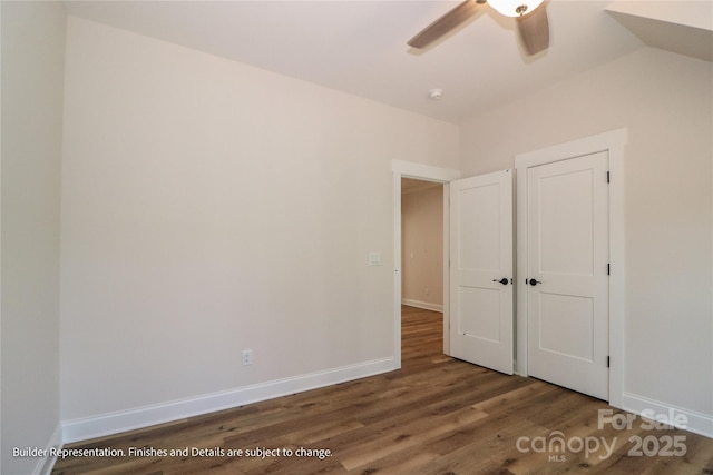 unfurnished bedroom featuring baseboards, wood finished floors, and ceiling fan