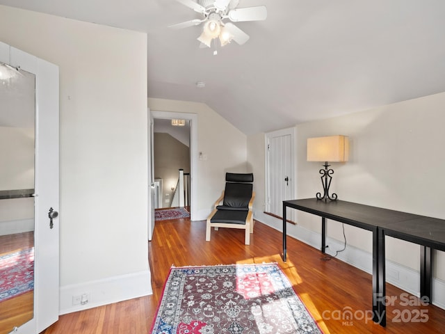 sitting room featuring wood-type flooring, ceiling fan, and vaulted ceiling