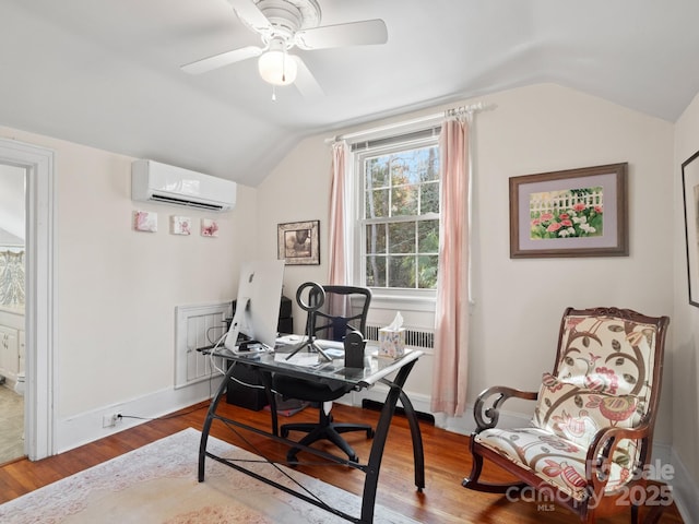 office space with lofted ceiling, hardwood / wood-style flooring, an AC wall unit, and ceiling fan