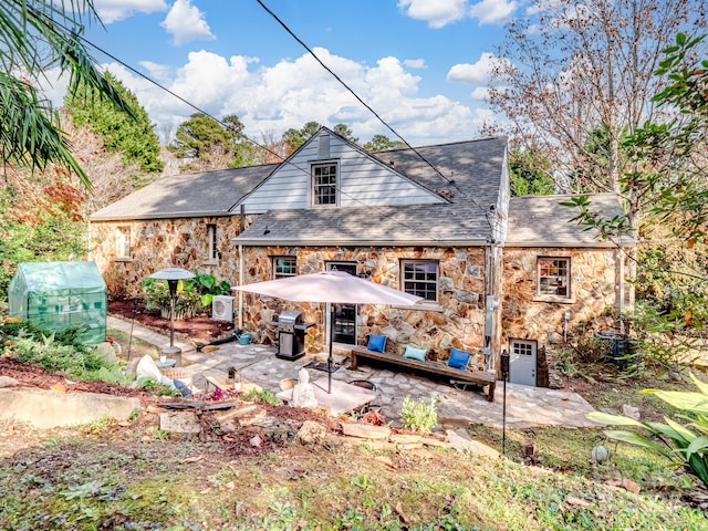 rear view of property featuring a patio