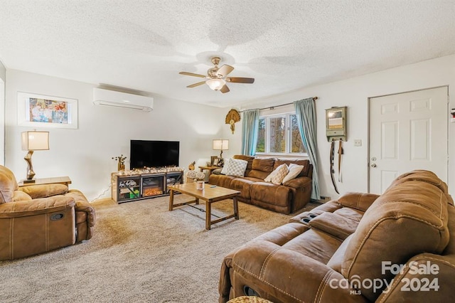 carpeted living room featuring a wall mounted air conditioner, a textured ceiling, and ceiling fan