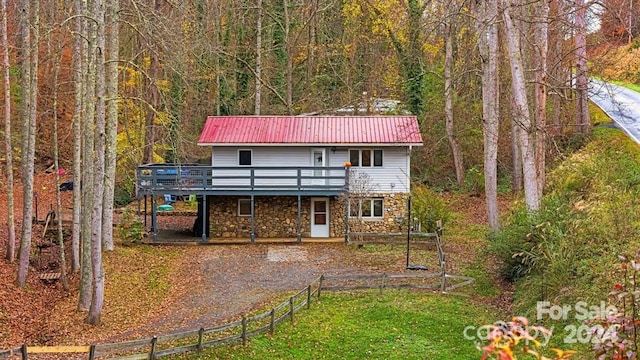 rear view of property with a deck