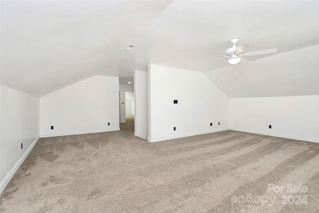 bonus room with carpet floors, vaulted ceiling, and ceiling fan