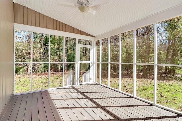 unfurnished sunroom featuring ceiling fan and vaulted ceiling