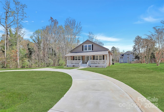 view of front of house featuring covered porch, concrete driveway, and a front yard