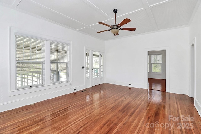 unfurnished living room with a healthy amount of sunlight, ceiling fan, and hardwood / wood-style floors