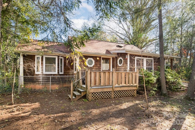 view of front facade featuring a wooden deck